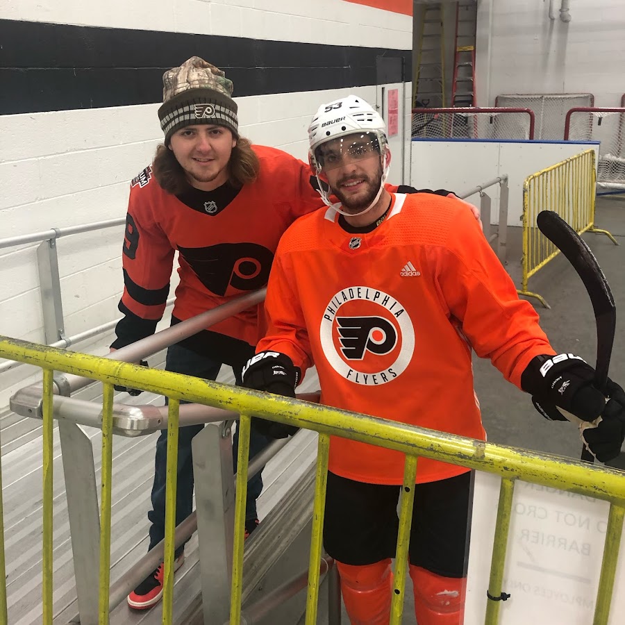 Philadelphia Flyers Players In The Locker Room Wearing Orange