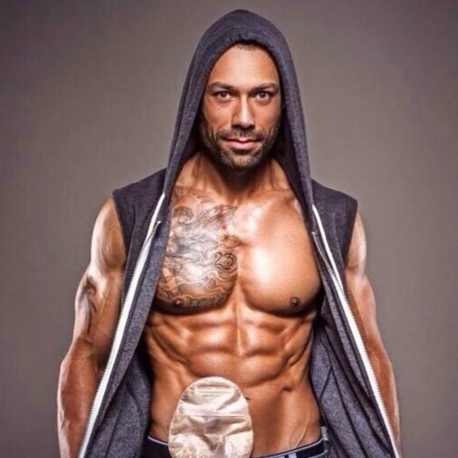 Male model Blake Beckford poses shirtless with ileostomy bag