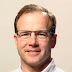 logo Troy Henikoff