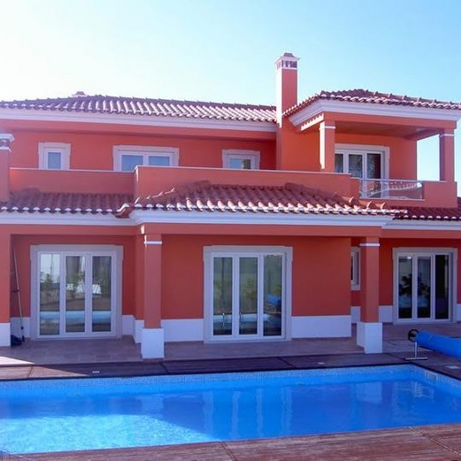 В одноэтажный розовом доме. Дом кораллового цвета. Розовый дом с бассейном. Дом оранжевого цвета. Фасады домов кораллового цвета.